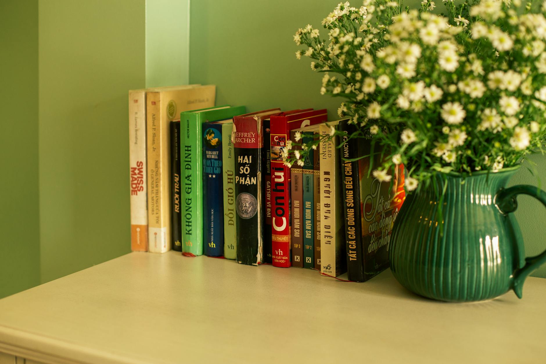 cozy bookshelf with flowers and books